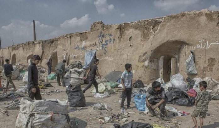 A-ruin-on-the-outskirts-of-an-Iranian-city-where-child-laborers-are-collecting-garbage-for-a-living