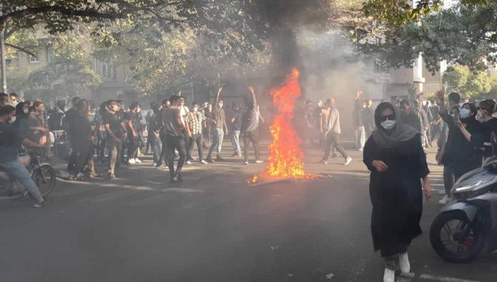 iran-uprising-youth-fire-1