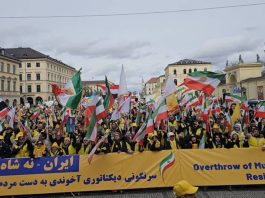 Rally masiv në Mynih më 13 shkurt 2026 jehon thirrjet e ngrihjes në Iran: “Jo Shah, Jo Mullahë”. Fjalimet e Maryam Rajavi, John Bercow dhe Struan Stevenson kërkojnë republikë demokratike, pa monarki apo teokraci. Mbështetje për popullin iranian kundër diktaturës.